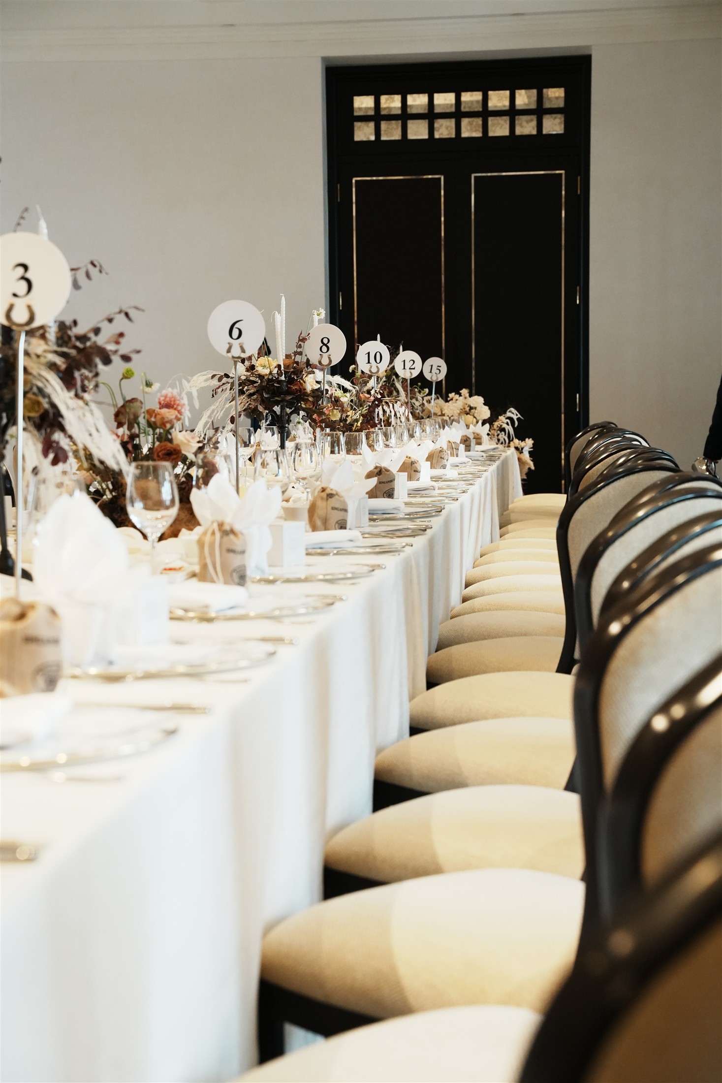 The repeated rhythm of flowers and chairs