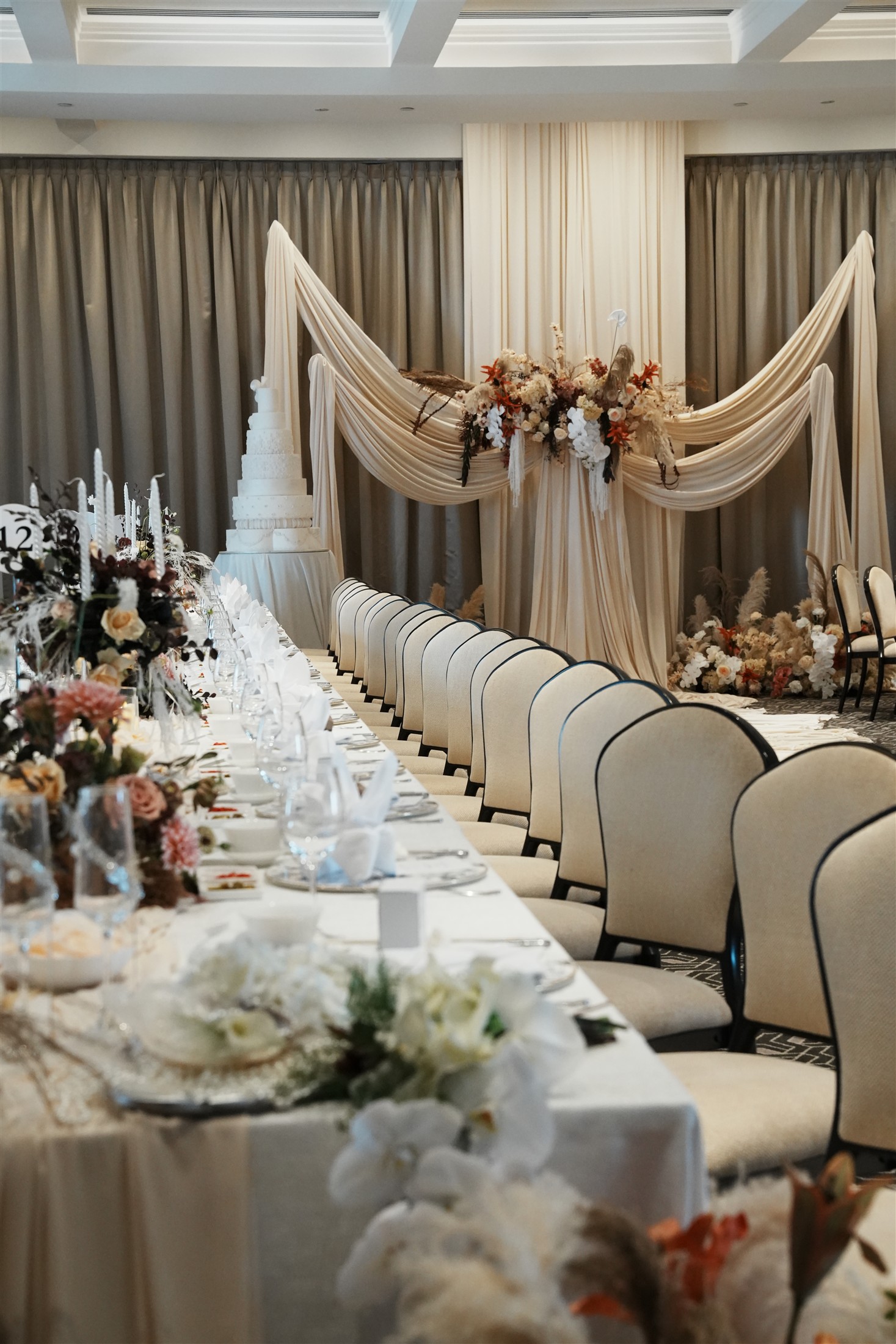 An entire wedding setting composed with soft fabric and florals