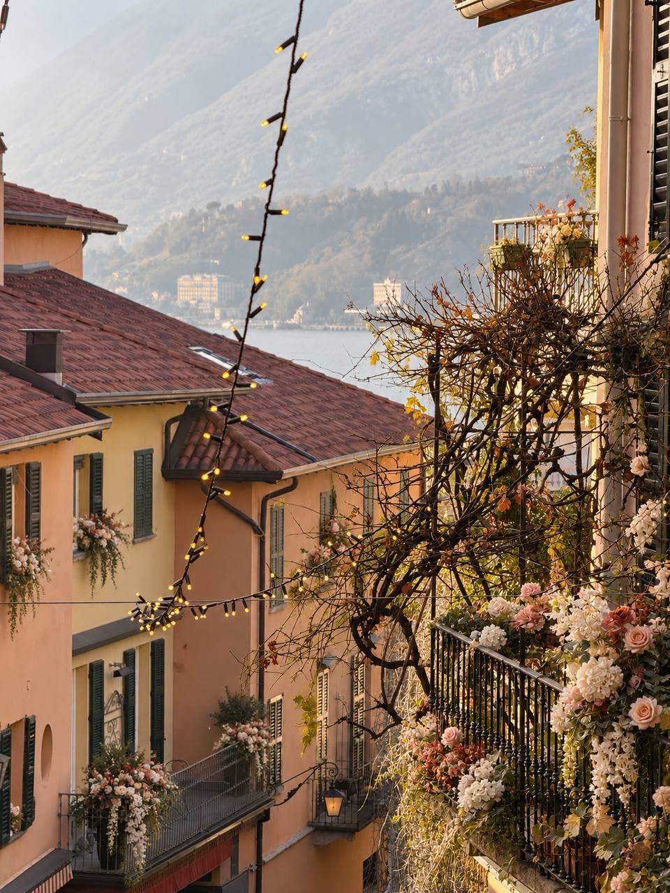 A lakeside view with warm-toned buildings and mountains from the couple’s first trip