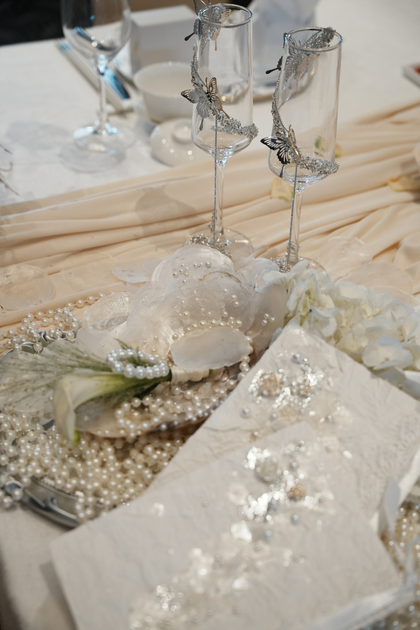 Delicate handmade translucent floral details at a place setting